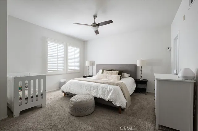 a bed room with a bed and a window