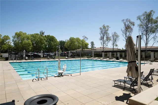 a view of a fountain with potted plants