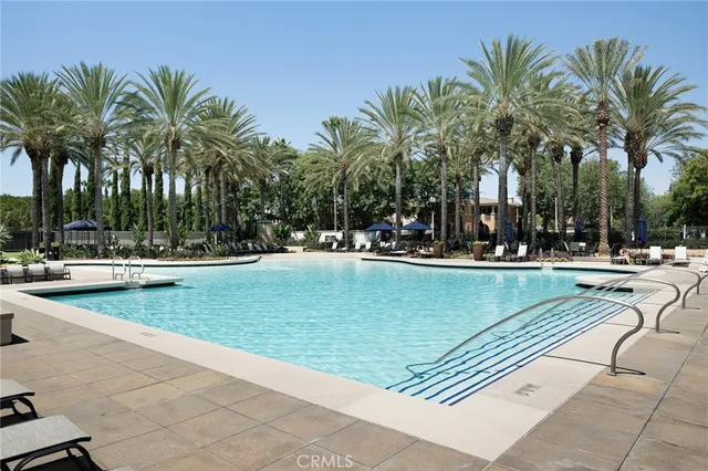 a view of a yard with plants and trees