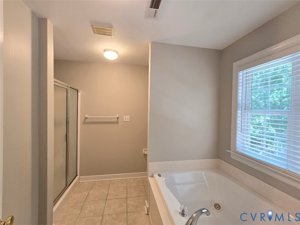 16406 Benmore Road Moseley, VA 23120 - Photo 16 of 32 a bathroom with a bathtub and shower