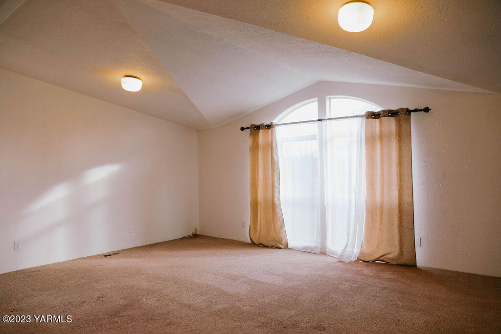 151 Rougk Lane Sunnyside, WA 98944 - Photo 7 of 43 a view of an empty room with a window