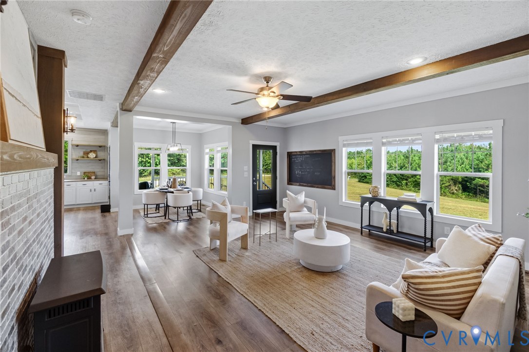 13110 Continental Road Wilsons, VA 23894 - Photo 15 of 35 Open-concept living area featuring wood-finish flo