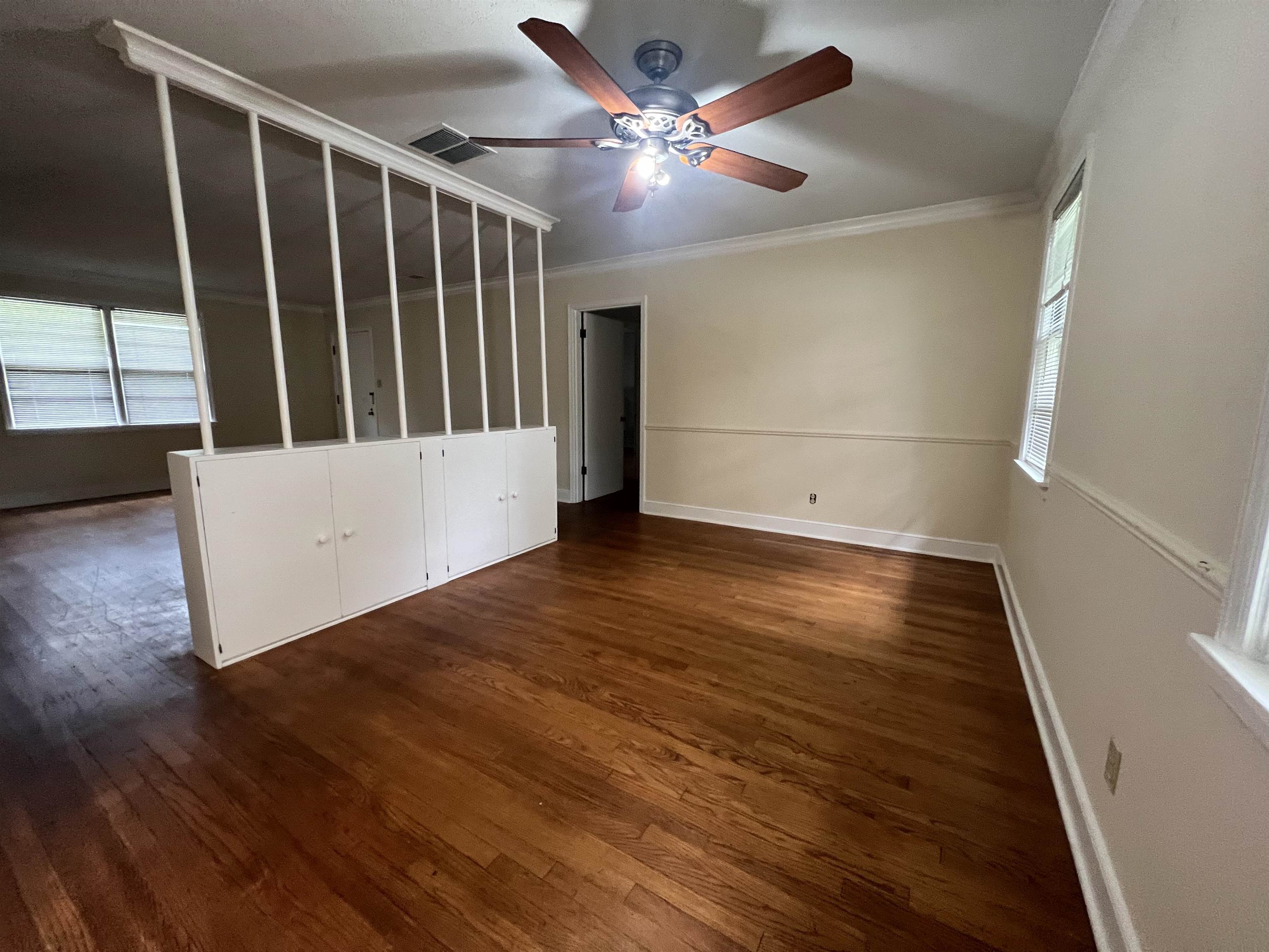 1048 West Perkins Road Memphis, TN 38117 - Photo 7 of 15 wooden floor in an empty room with a window
