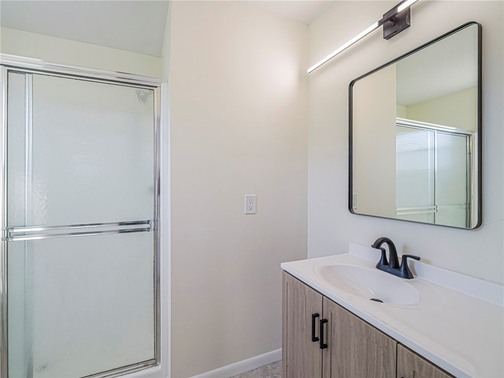 1331 Barber Street Sebastian, FL 32958 - Photo 14 of 32 a bathroom with a sink and a mirror