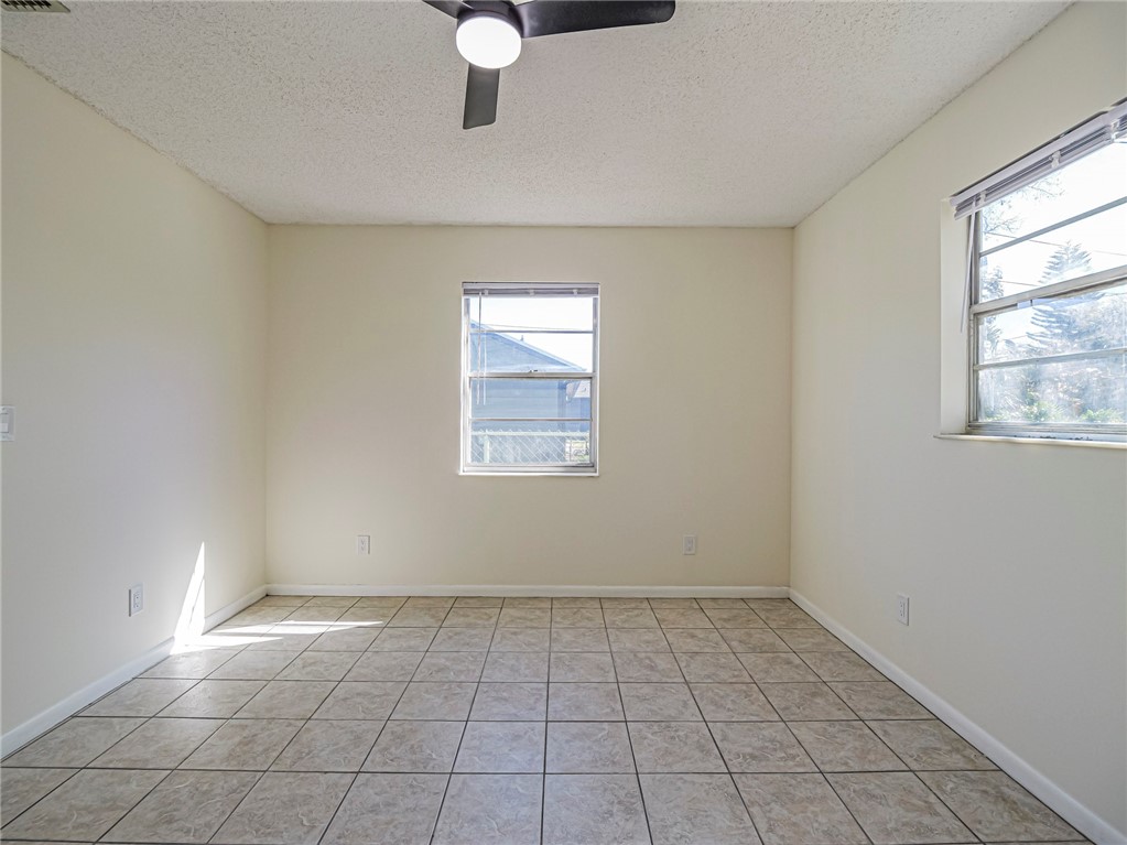 1331 Barber Street Sebastian, FL 32958 - Photo 18 of 32 an empty room with windows