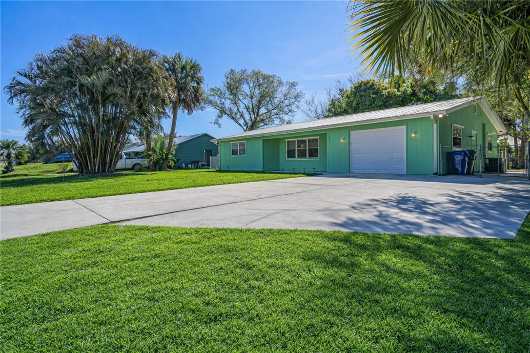1331 Barber Street Sebastian, FL 32958 - Photo 2 of 32 a front view of house with yard and green space