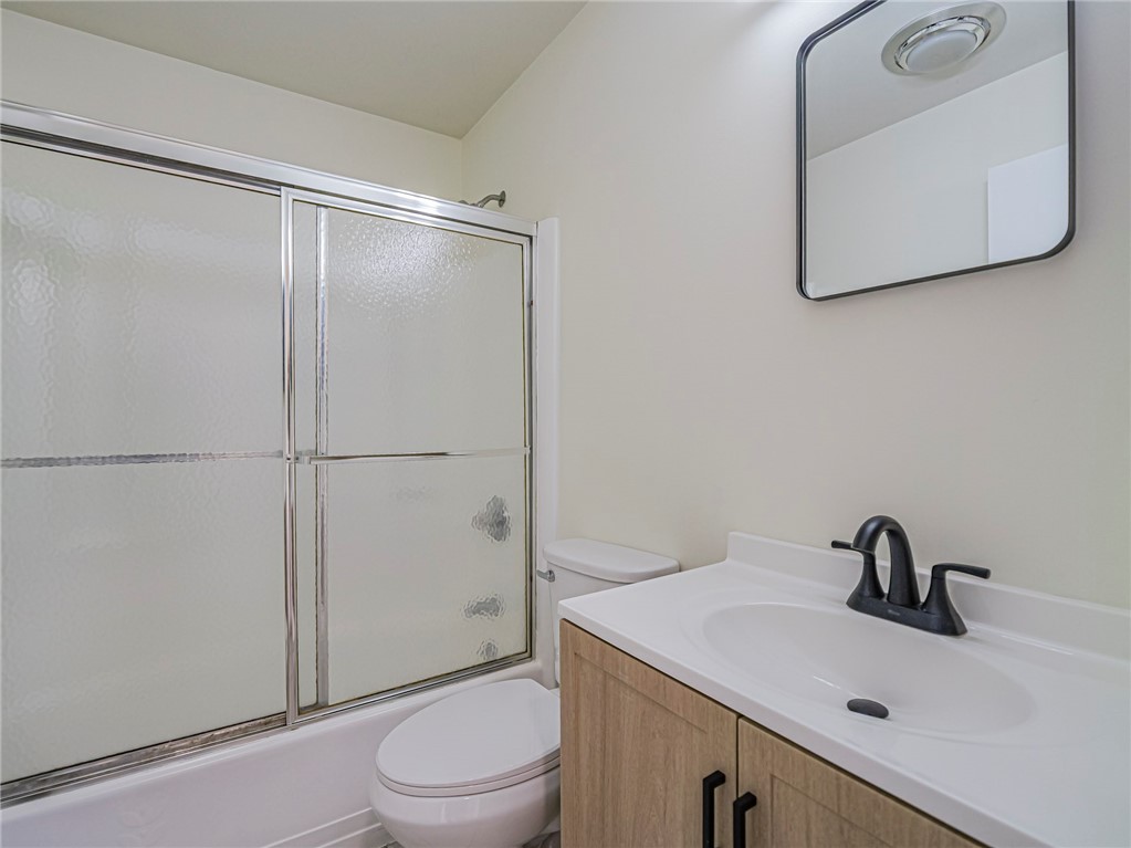 1331 Barber Street Sebastian, FL 32958 - Photo 21 of 32 a bathroom with a sink a toilet and shower