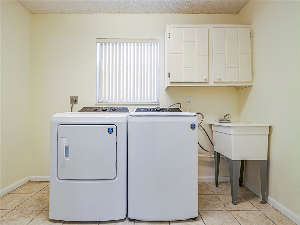 1331 Barber Street Sebastian, FL 32958 - Photo 22 of 32 a utility room with dryer and washer