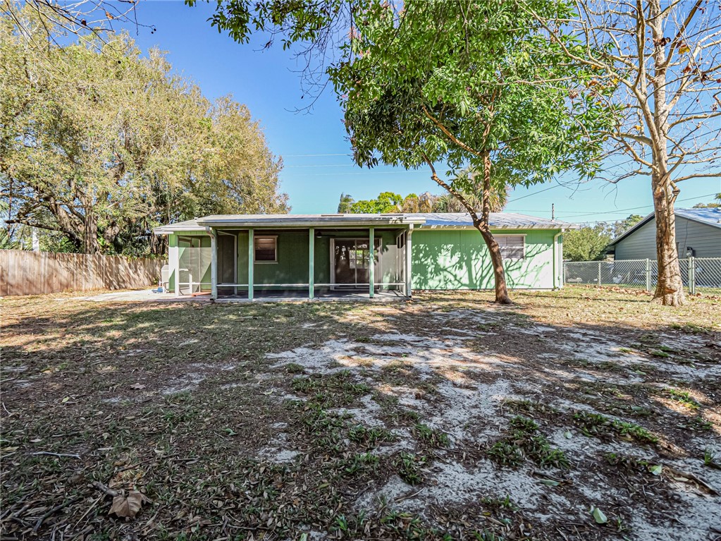 1331 Barber Street Sebastian, FL 32958 - Photo 28 of 32 a front view of a house with a garden