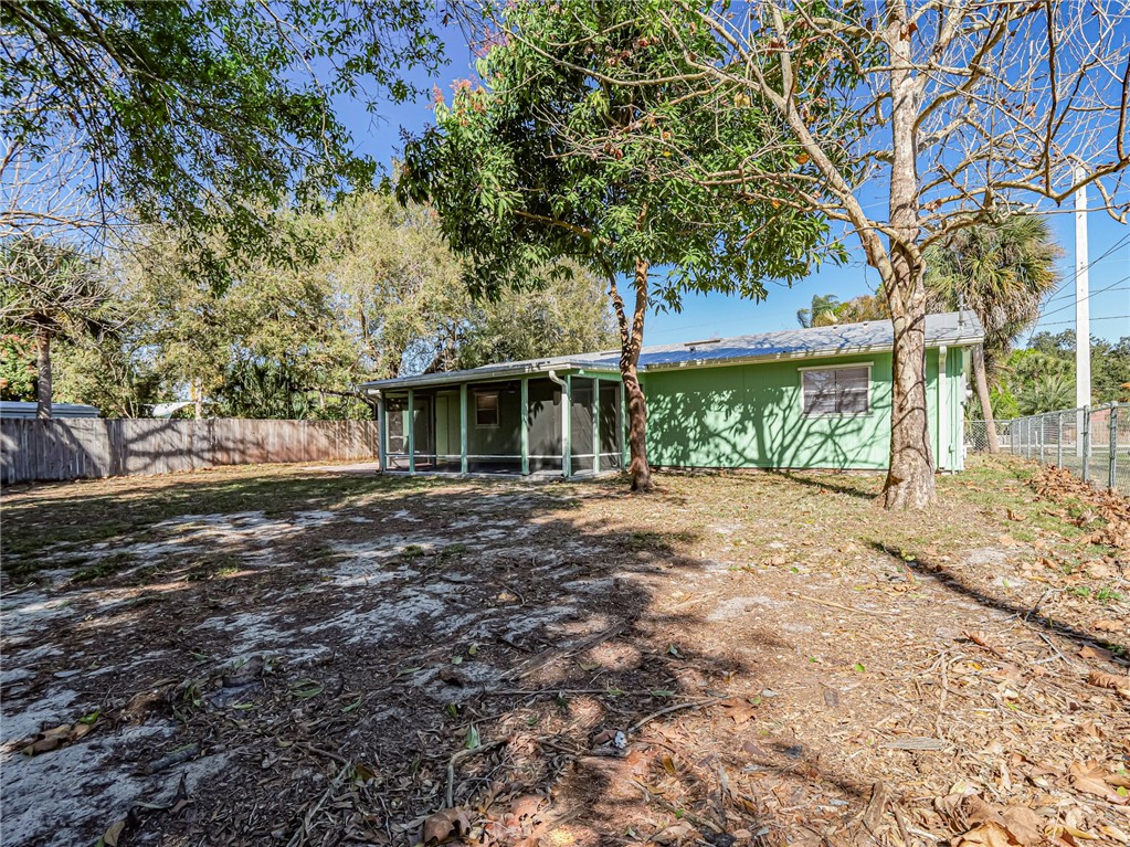 1331 Barber Street Sebastian, FL 32958 - Photo 29 of 32 a view of a yard with a tree