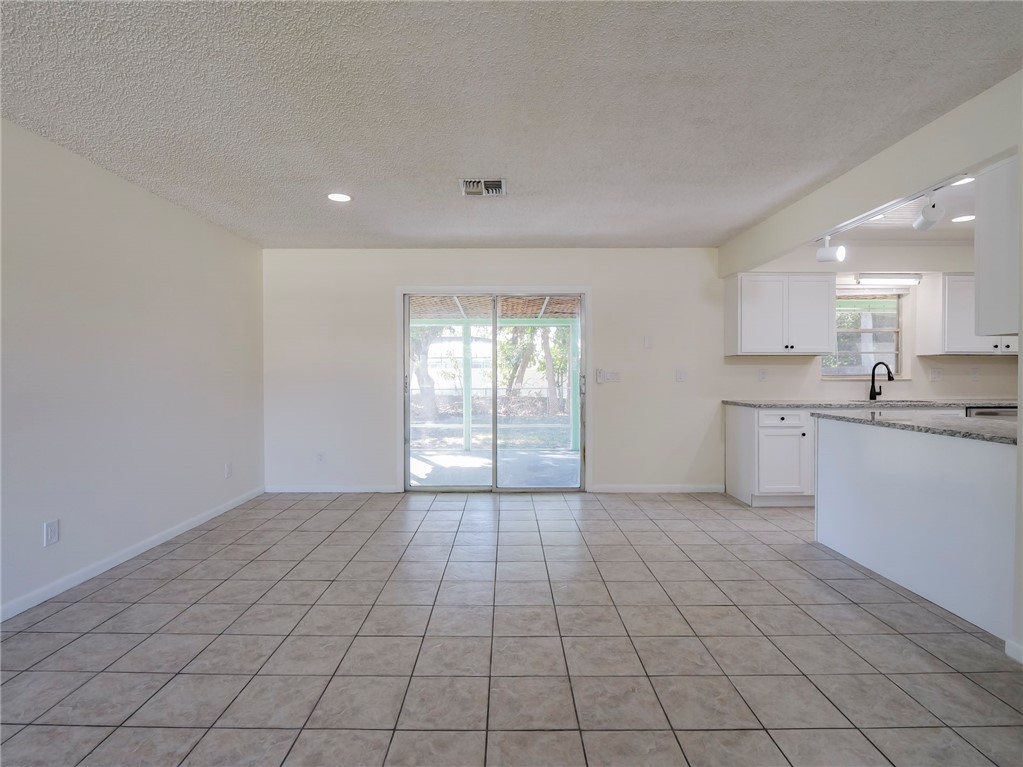 1331 Barber Street Sebastian, FL 32958 - Photo 6 of 32 a view of a kitchen with a sink and dishwasher cabinets