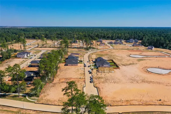 a view of a swimming pool with lawn chairs