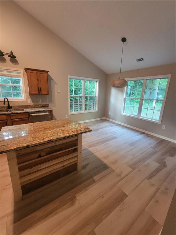 435 Butler Bridge Circle Covington, GA 30016 - Photo 20 of 25 a view of room with window and wooden floor