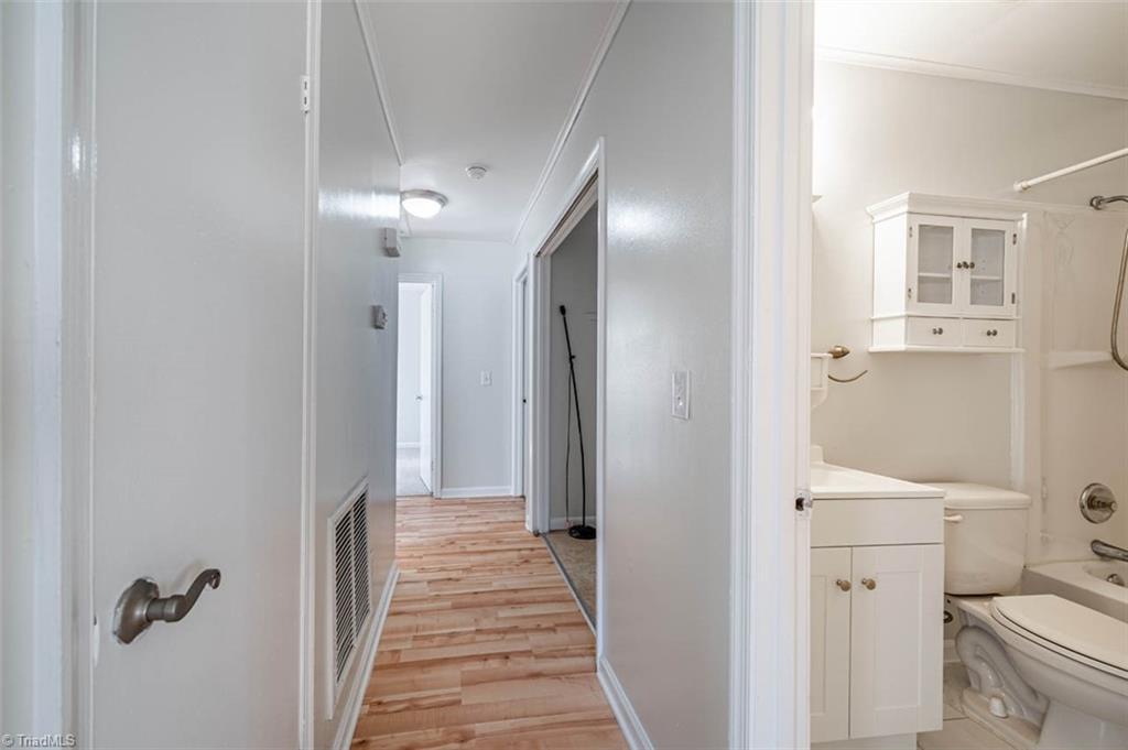 5108 McCormick Road Durham, NC 27713 - Photo 11 of 21 Hallway to bedroom, full bath on right