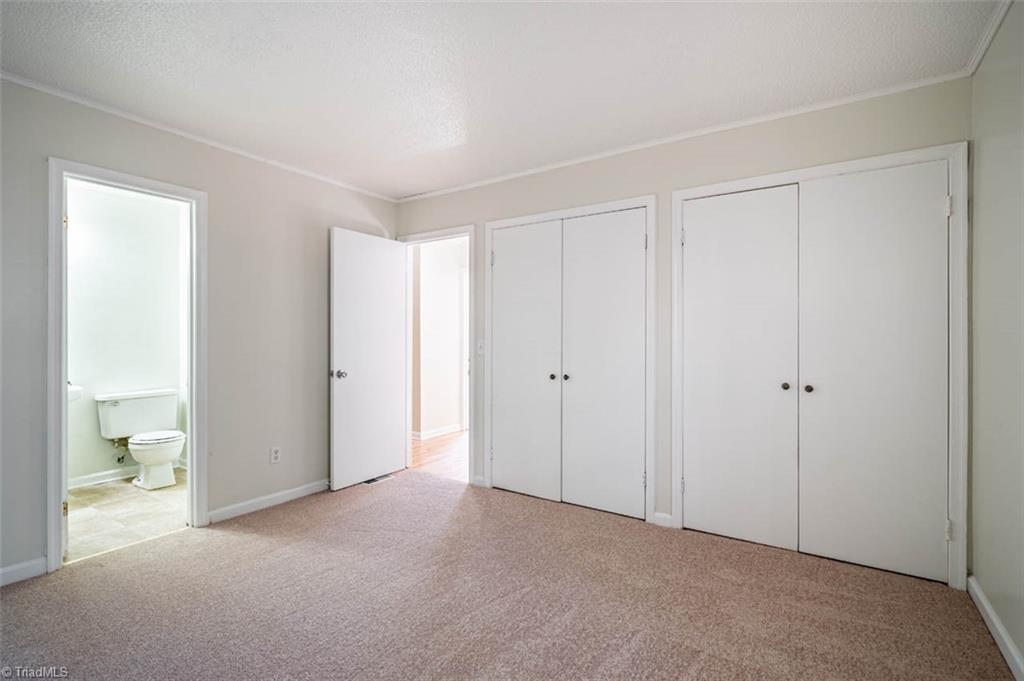5108 McCormick Road Durham, NC 27713 - Photo 13 of 21 Master bedroom w/half bath