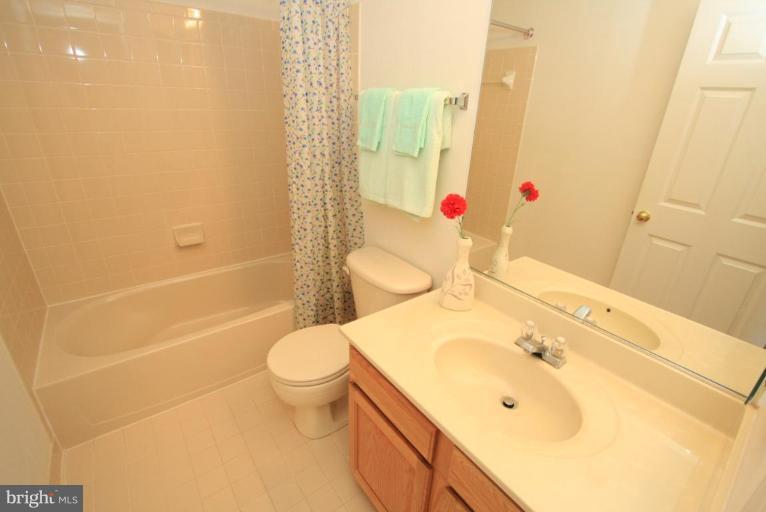 18604 Broken Oak Road Boyds, MD 20841 - Photo 8 of 18 a bathroom with a sink toilet and shower