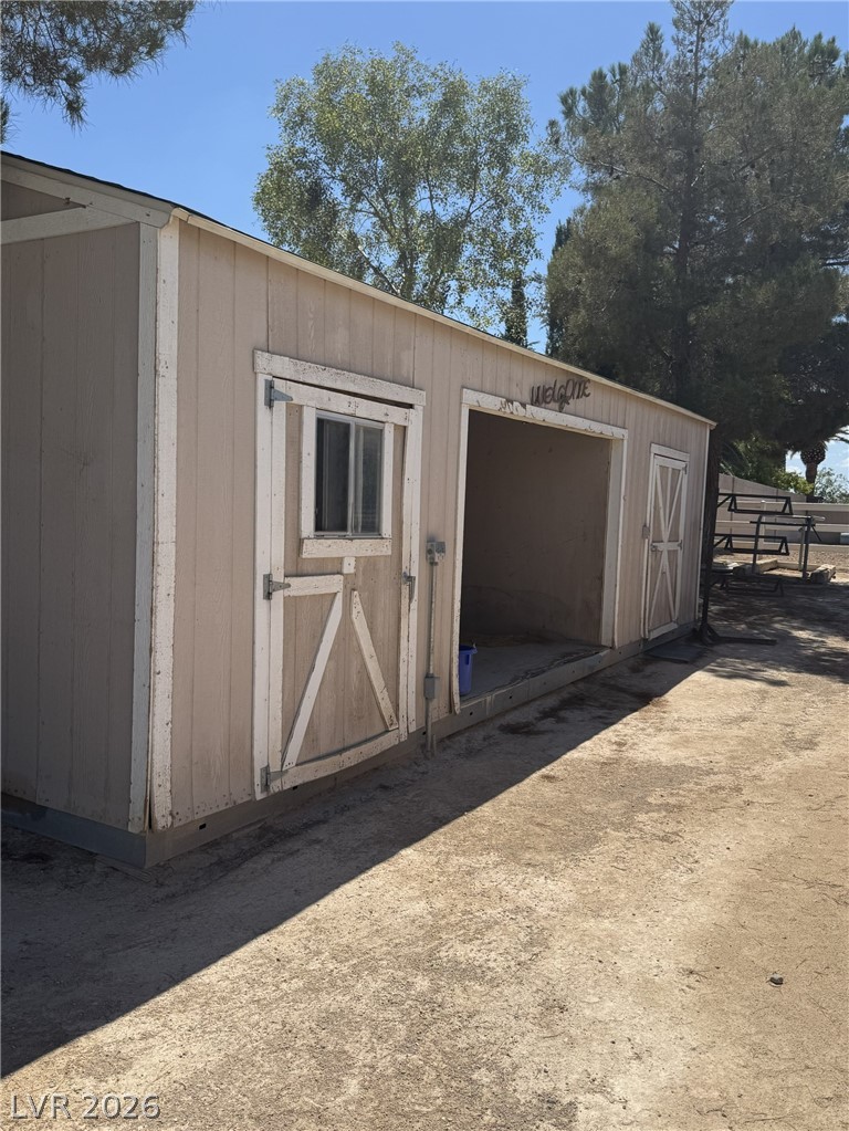 167 East Robindale Road Las Vegas, NV 89123 - Photo 6 of 15 An exterior outbuilding provides practical storage and workspace options on the property grounds.
