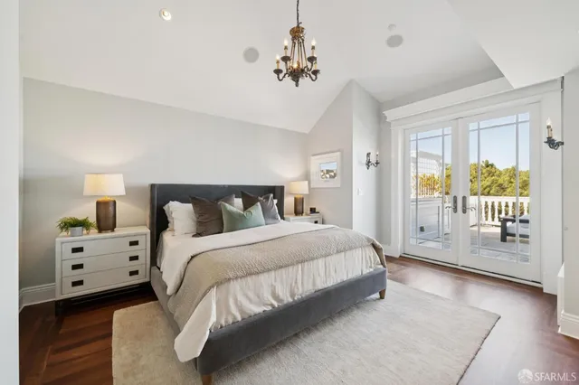a bathroom with a granite countertop sink a mirror and a shower