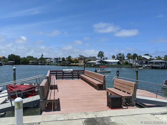 a view of a swimming pool with a lounge chairs