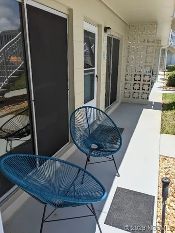 a view of balcony with furniture