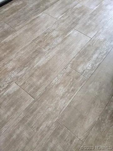 a kitchen with stainless steel appliances granite countertop a sink a stove a refrigerator and island