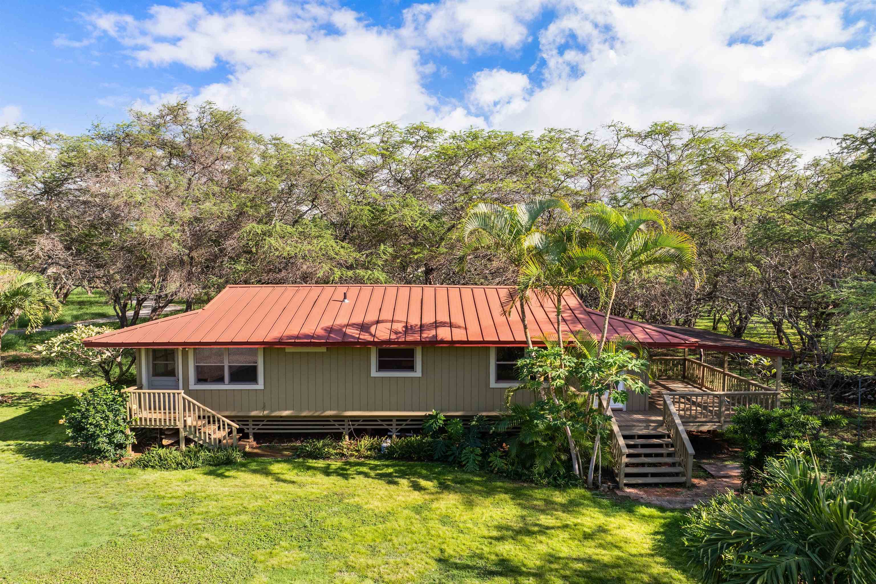 2944 Kalua Koi Road Maunaloa, HI 96770 - Photo 41 of 47 a front view of a house with a yard