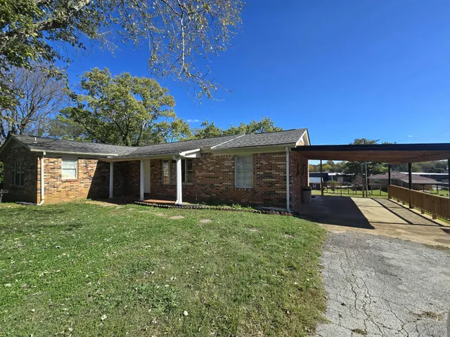 a view of a backyard of the house
