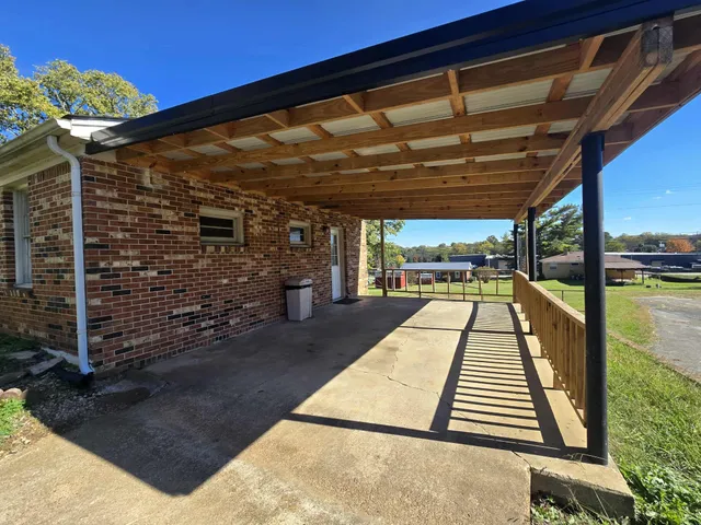 a view of a balcony with wooden floor