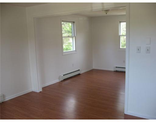 192 Chaplin Mills Road Naples, ME 04055 - Photo 9 of 19 Dining Room. Living room opens to...
