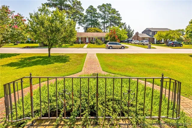 a view of swimming pool with an outdoor seating