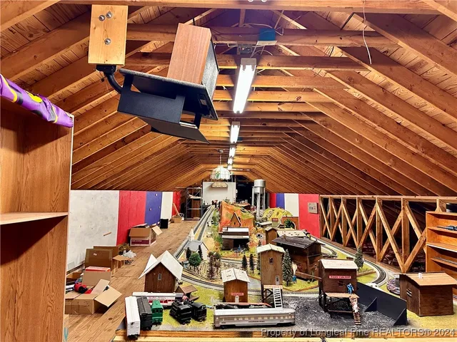 a view of a balcony with wooden floor and windows