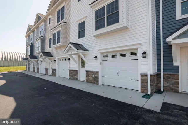 a view of a house with a street
