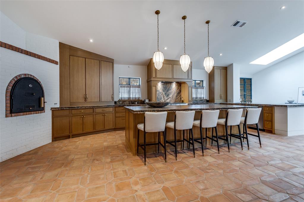 1308 San Rafael Drive Dallas, TX 75218 - Photo 13 of 40 a open kitchen with cabinets and stainless steel appliances