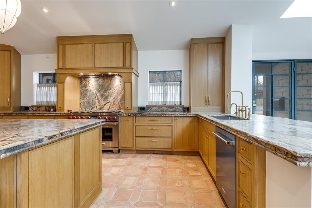 1308 San Rafael Drive Dallas, TX 75218 - Photo 14 of 40 a large kitchen with a sink and cabinets