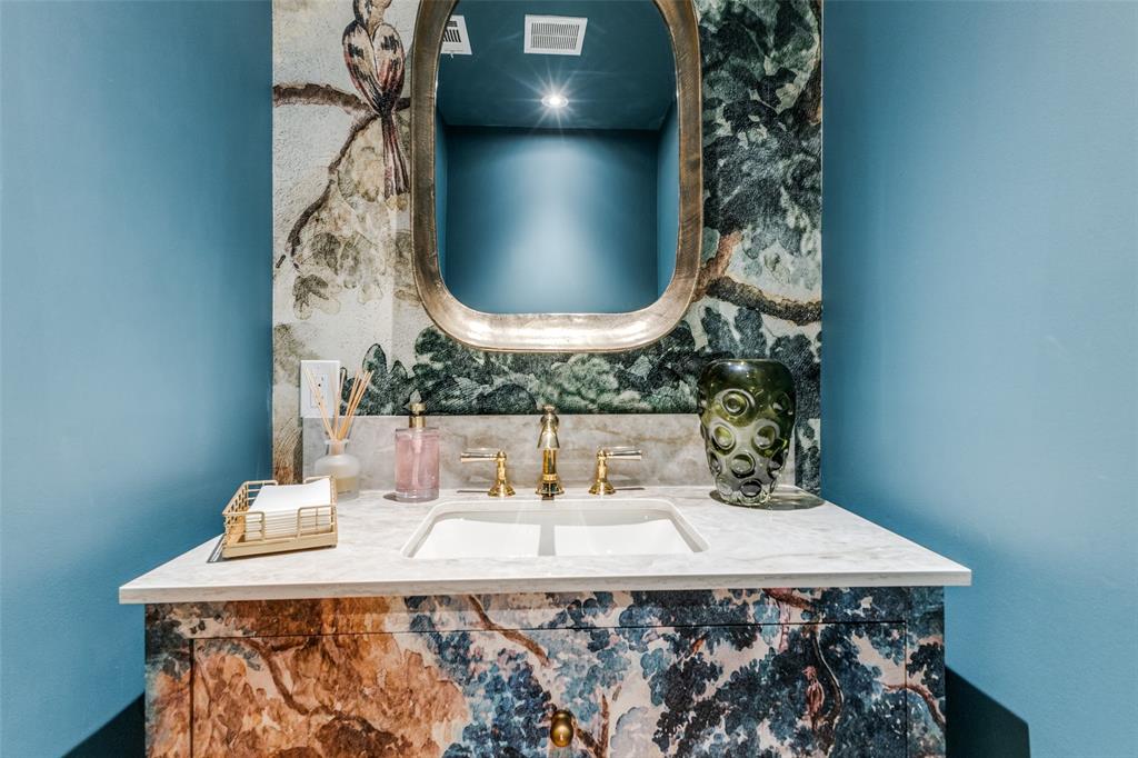 1308 San Rafael Drive Dallas, TX 75218 - Photo 23 of 40 a bathroom with a sink and a mirror