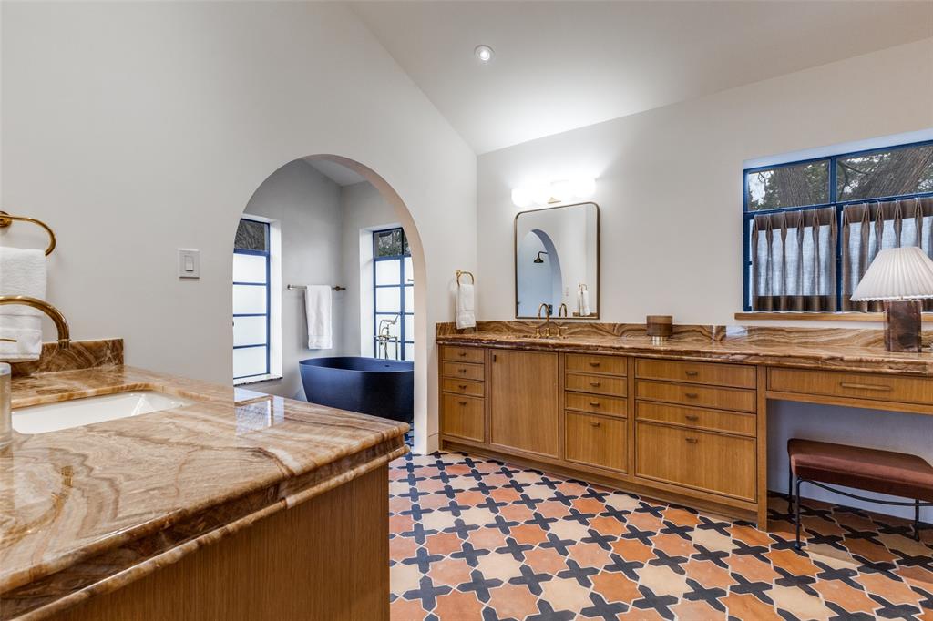 1308 San Rafael Drive Dallas, TX 75218 - Photo 26 of 40 a spacious bathroom with a granite countertop sink and a mirror