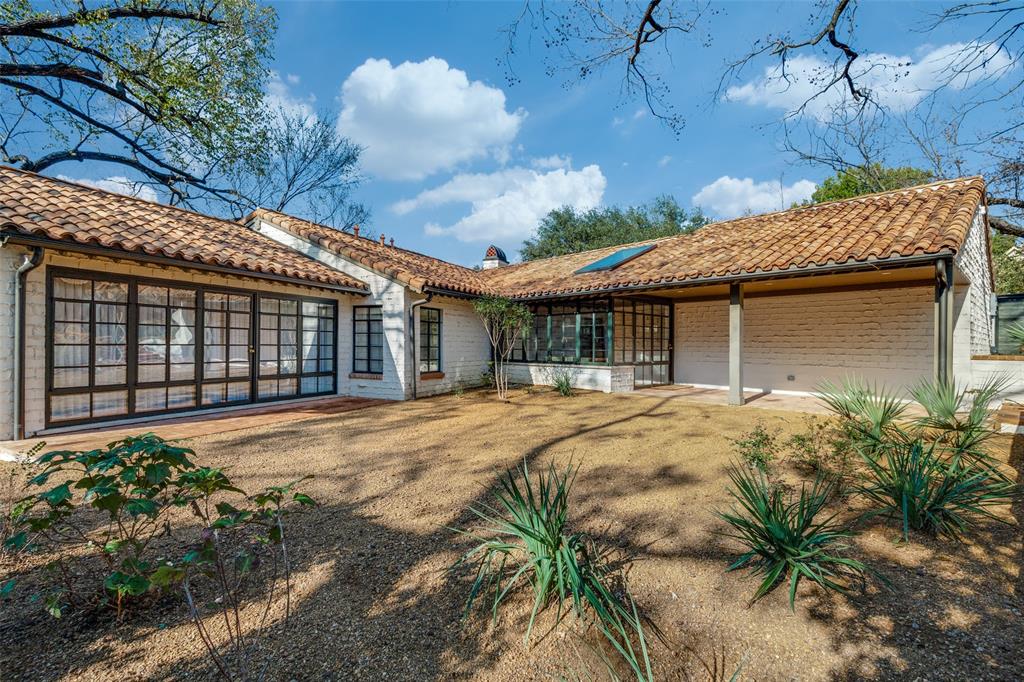 1308 San Rafael Drive Dallas, TX 75218 - Photo 33 of 40 a front view of a house with a garden