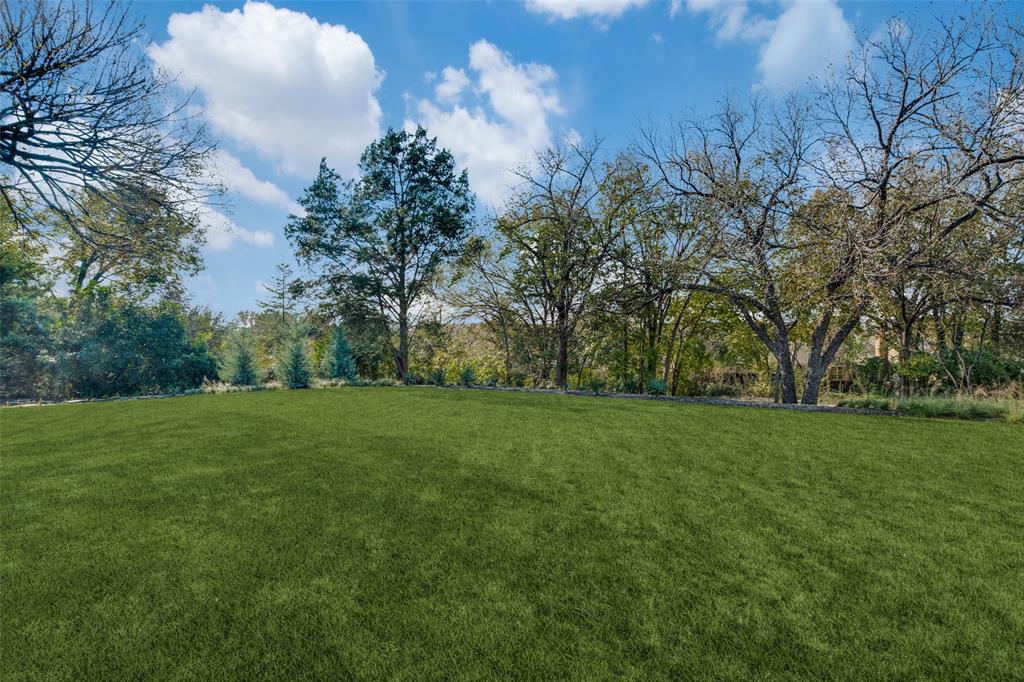 1308 San Rafael Drive Dallas, TX 75218 - Photo 37 of 40 a view of a grassy field with trees