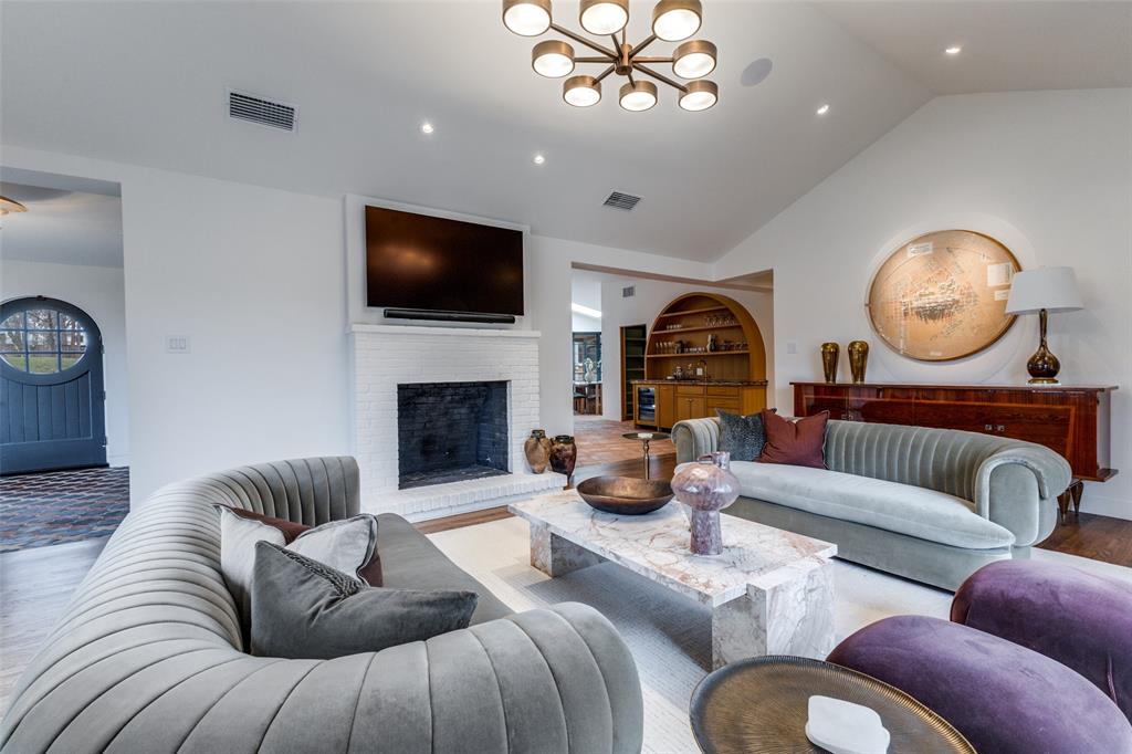1308 San Rafael Drive Dallas, TX 75218 - Photo 5 of 40 a living room with furniture a flat screen tv and a fireplace
