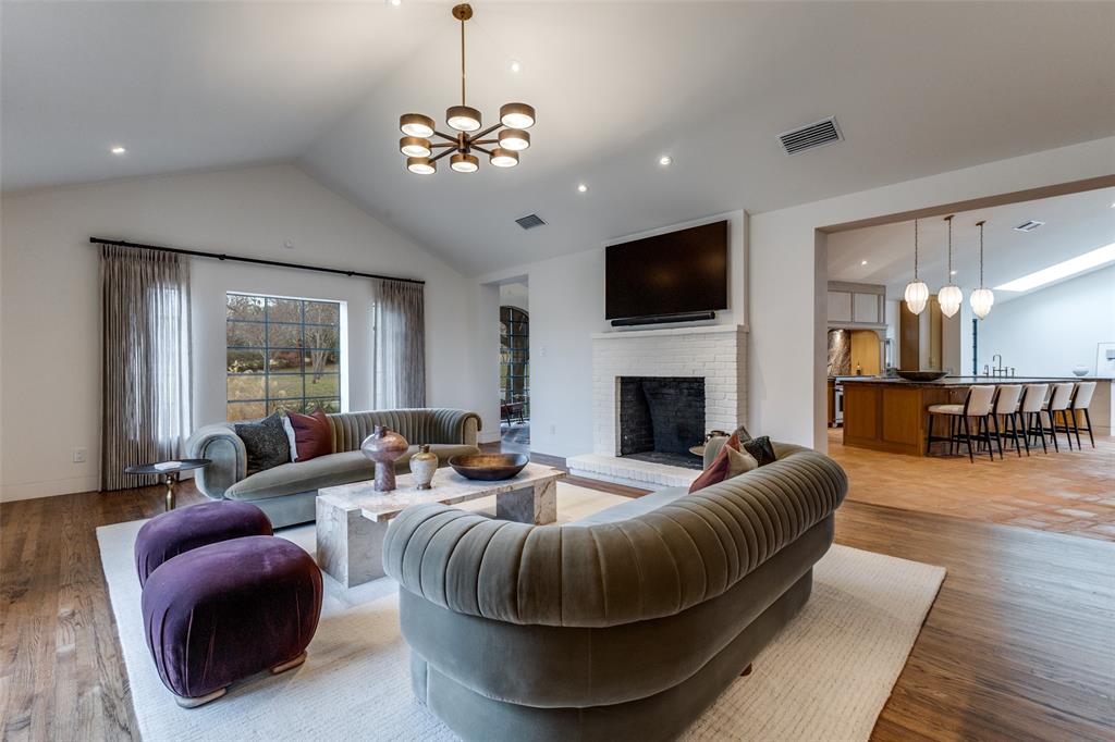 1308 San Rafael Drive Dallas, TX 75218 - Photo 6 of 40 a living room with furniture a flat screen tv and a fireplace