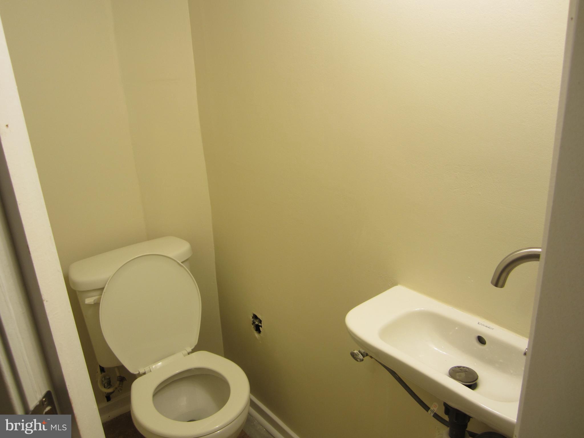 642 Brisbane Road Baltimore, MD 21229 - Photo 12 of 16 a bathroom with a sink and a toilet