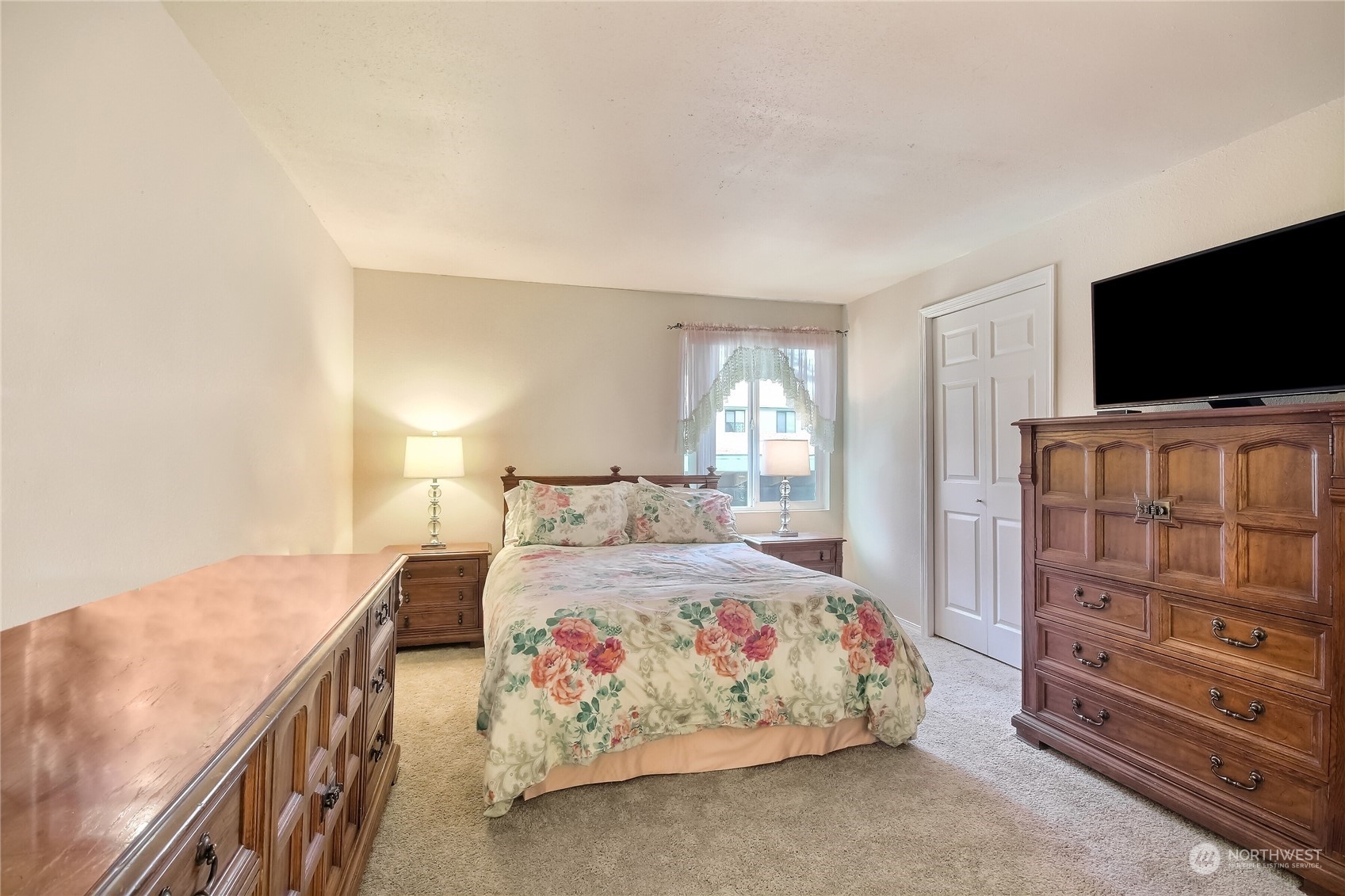 2003 Southwest 318th Place, Unit D8 Federal Way, WA 98023 - Photo 13 of 35 a bedroom with a bed and a flat screen tv