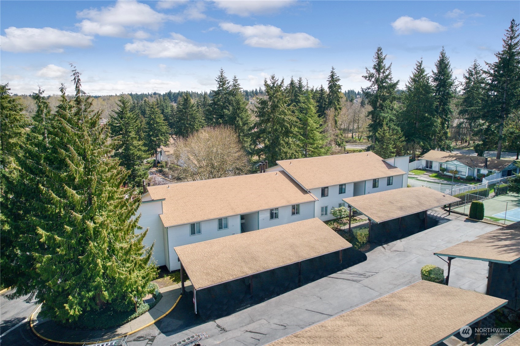 2003 Southwest 318th Place, Unit D8 Federal Way, WA 98023 - Photo 16 of 35 an aerial view of a house with swimming pool and a yard