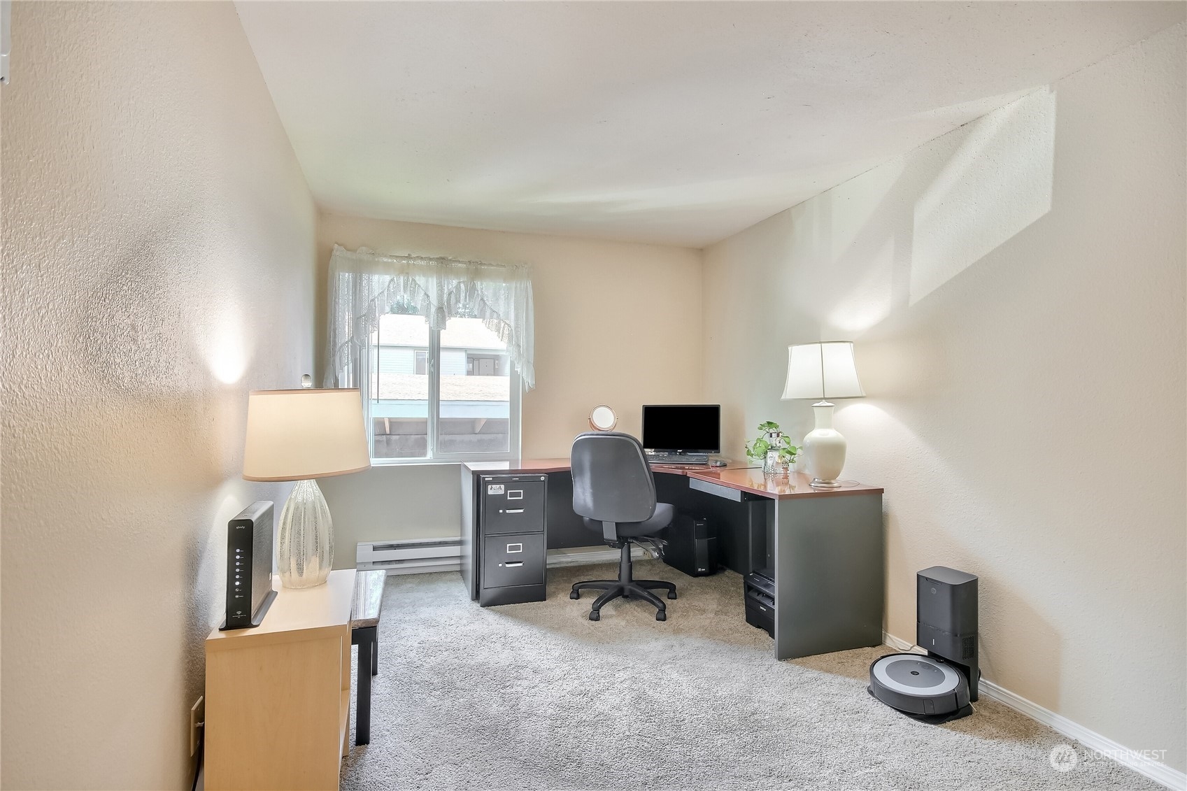 2003 Southwest 318th Place, Unit D8 Federal Way, WA 98023 - Photo 10 of 35 a view of a workspace with furniture and a window