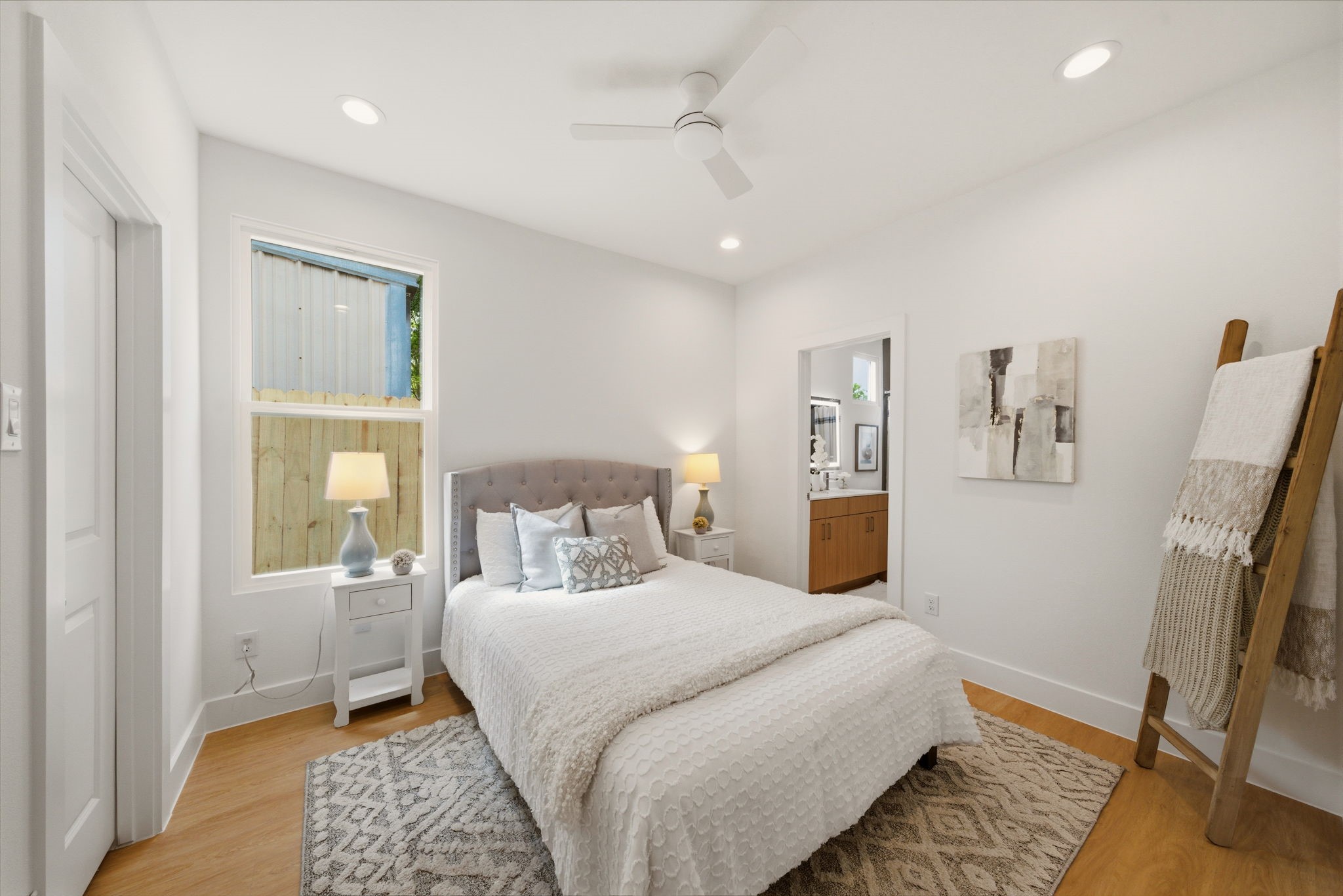 6514 Luce Street Houston, TX 77087 - Photo 13 of 34 a bedroom with a large bed and a window