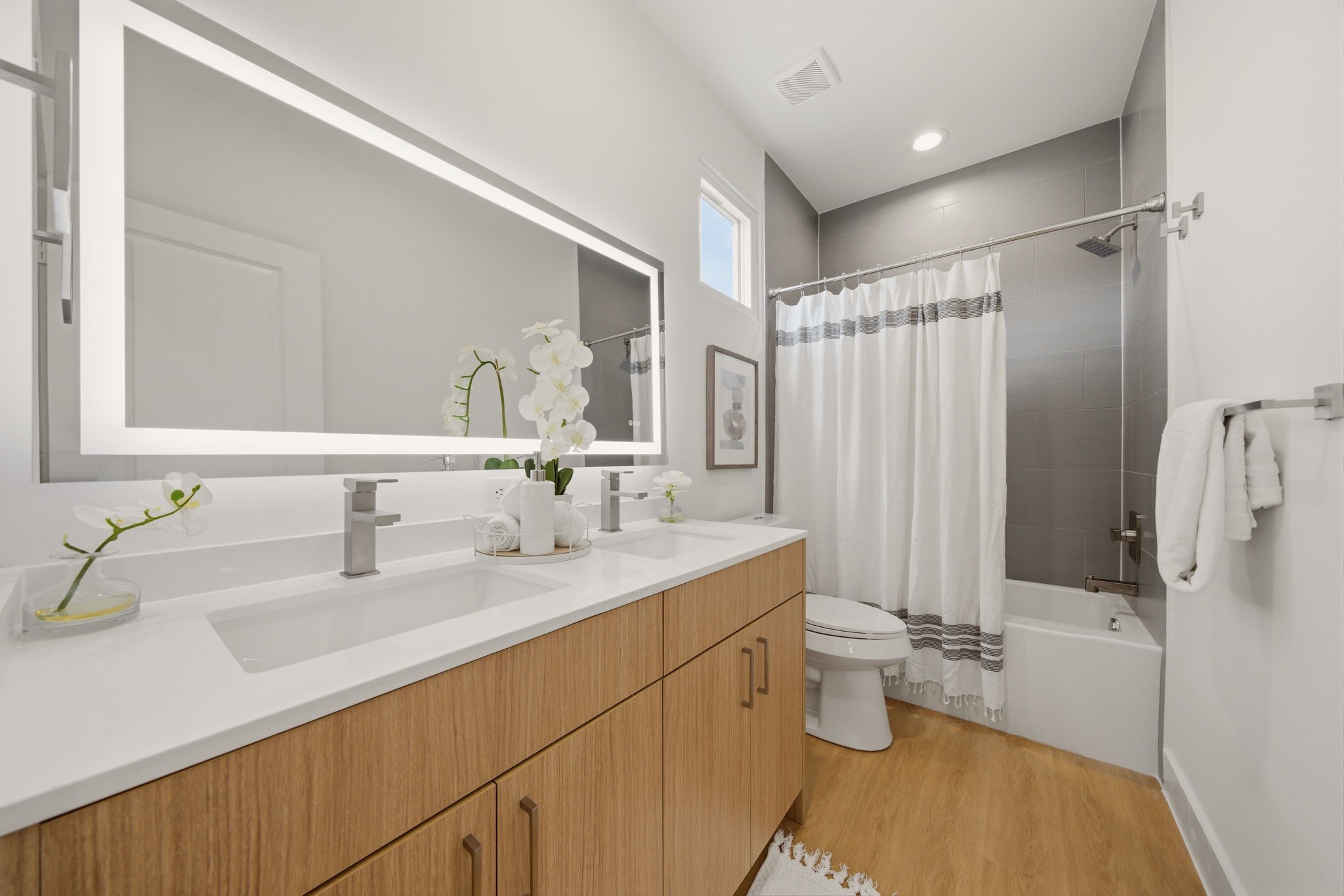 6514 Luce Street Houston, TX 77087 - Photo 14 of 34 a bathroom with a double vanity sink mirror and toilet
