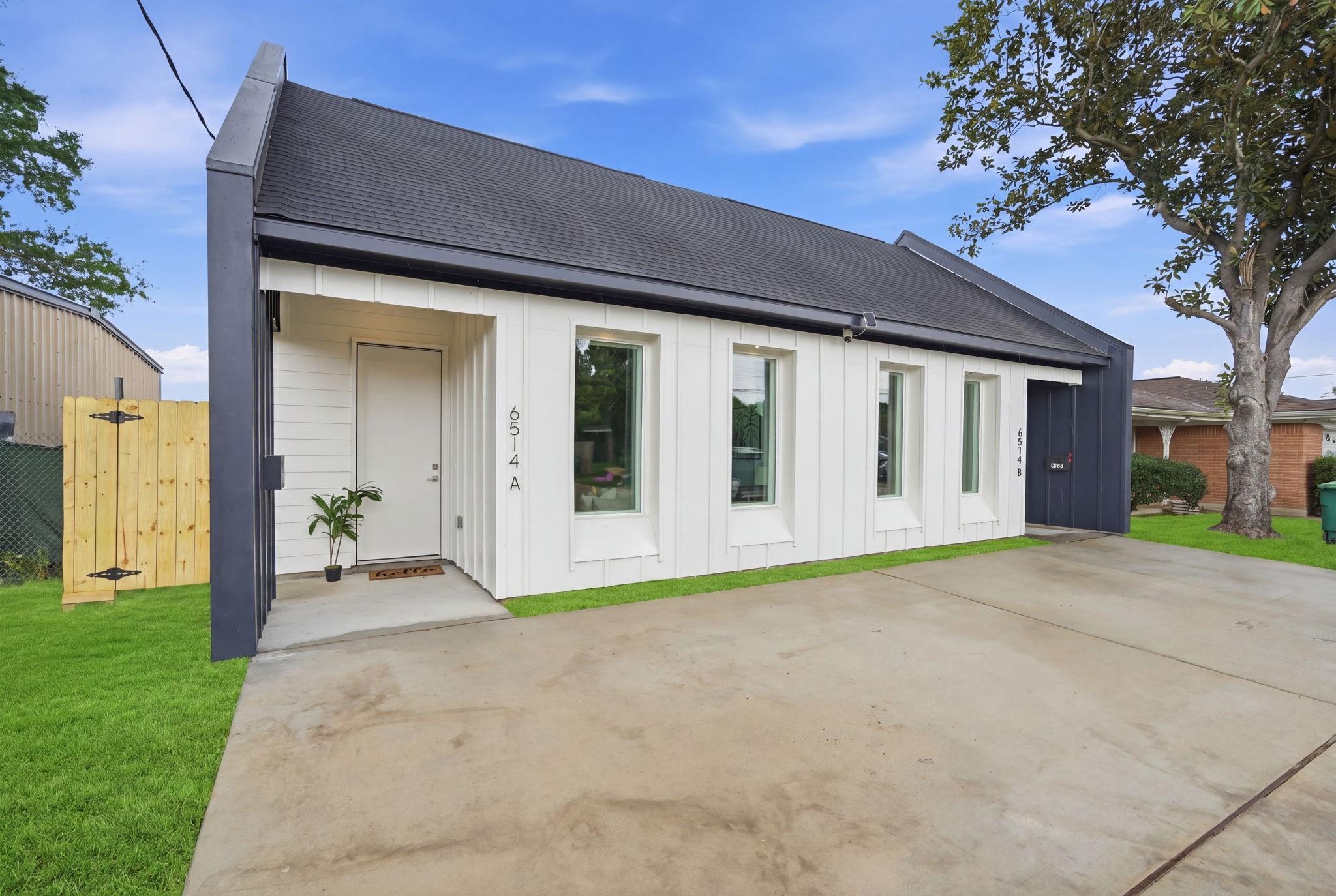 6514 Luce Street Houston, TX 77087 - Photo 2 of 34 a front view of a house with a garden