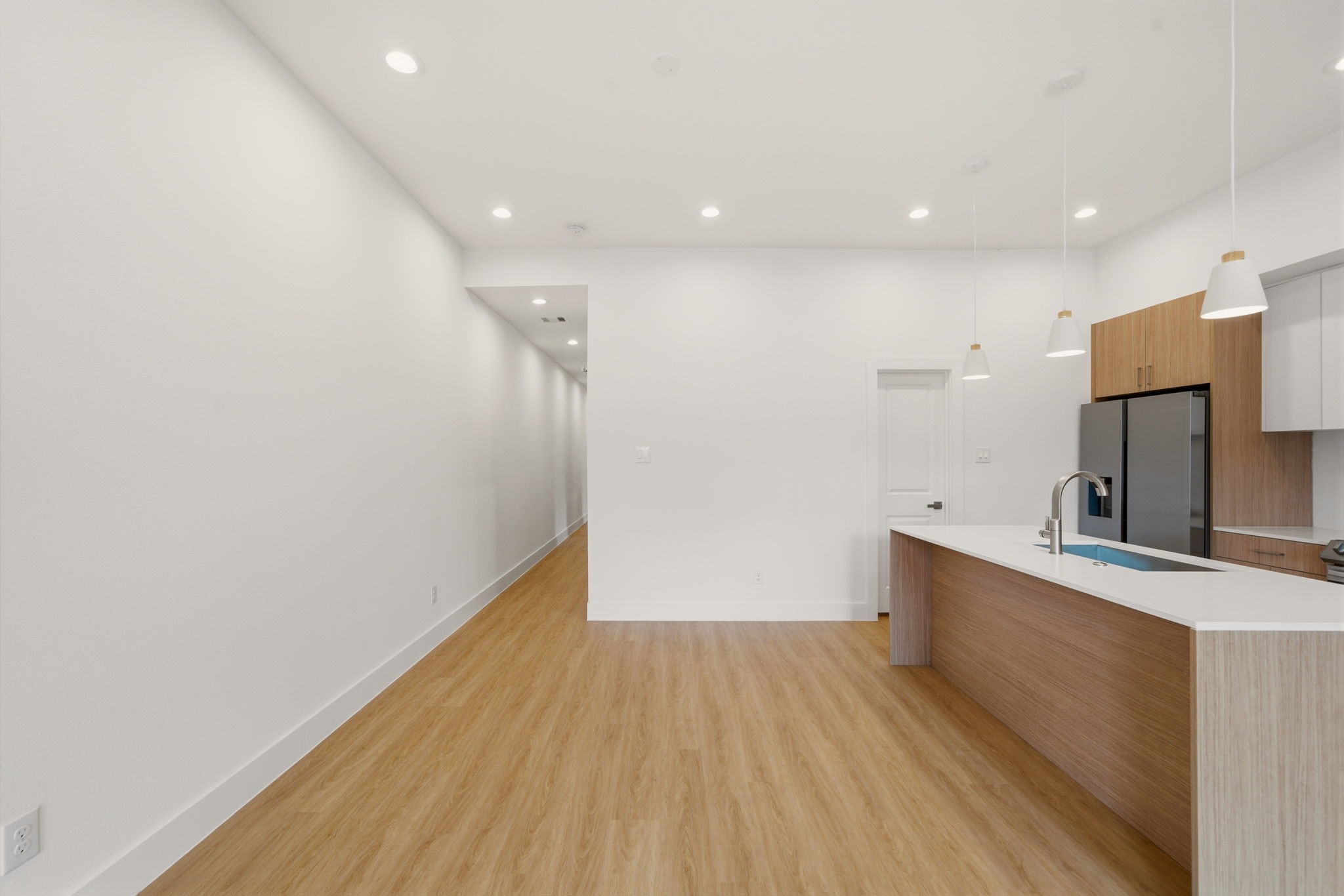 6514 Luce Street Houston, TX 77087 - Photo 25 of 34 a view of a kitchen with a sink and wooden floor