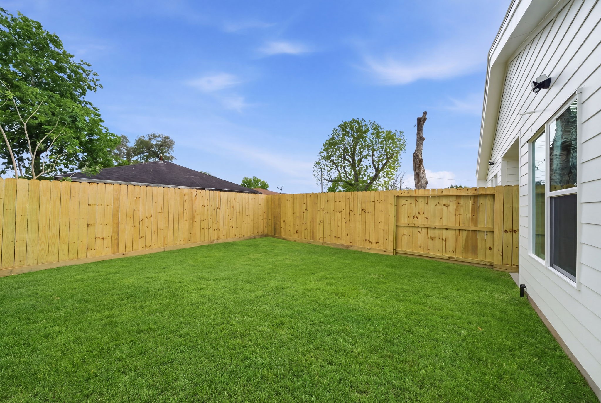6514 Luce Street Houston, TX 77087 - Photo 34 of 34 a view of an outdoor space and a yard