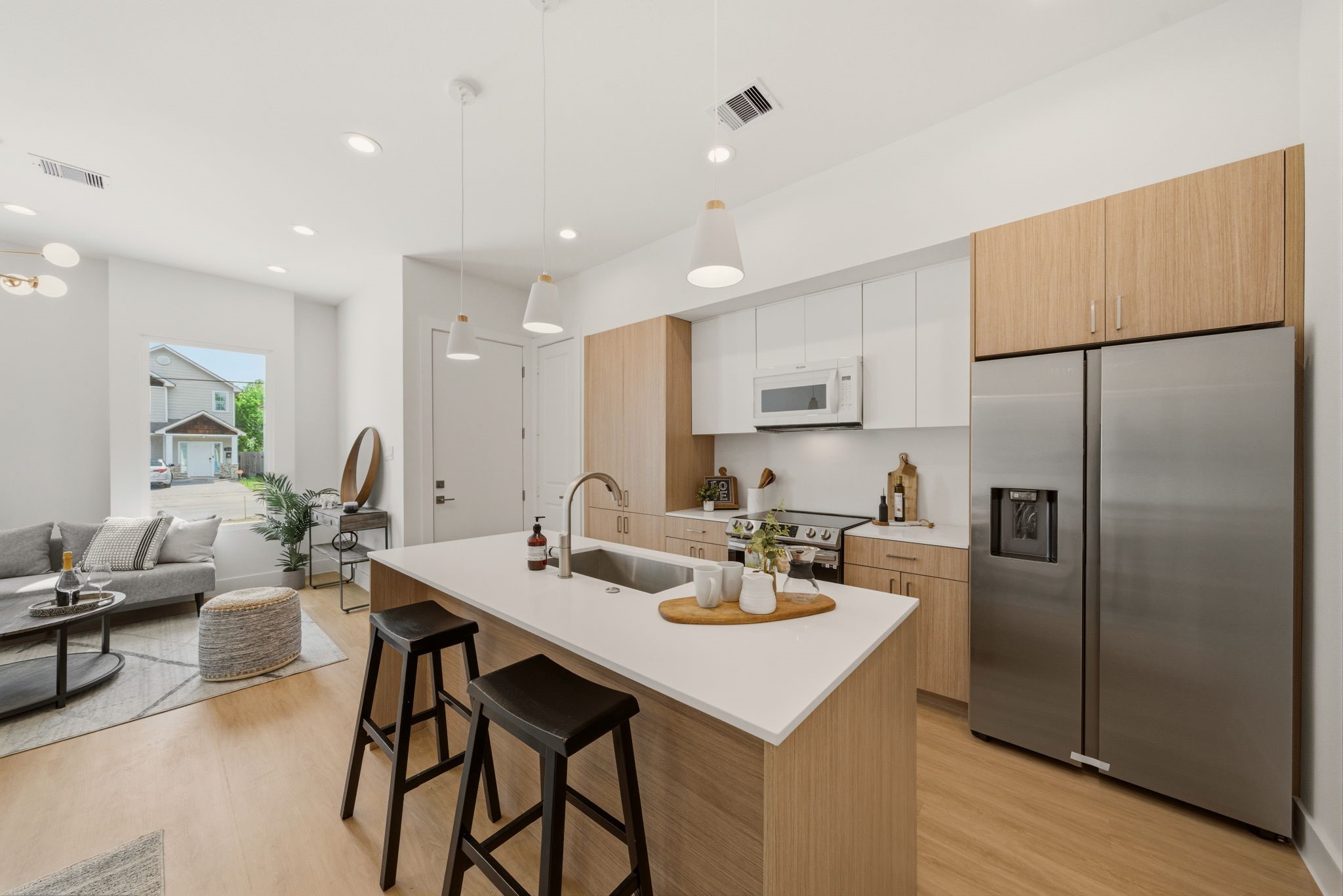 6514 Luce Street Houston, TX 77087 - Photo 10 of 34 a kitchen with stainless steel appliances refrigerator dining table and chairs